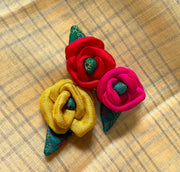 Set of three kasuti clips shaped as embroidered rose bunch
